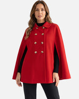 Back view of the cape coat showing the full-length flared silhouette