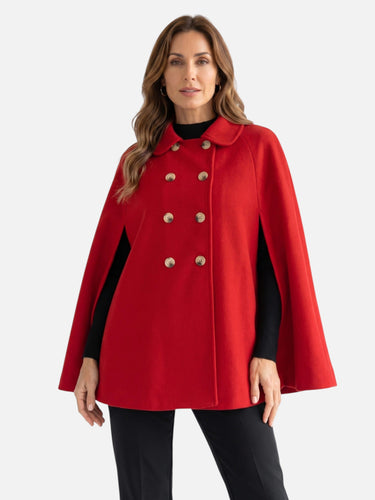 Back view of the cape coat showing the full-length flared silhouette