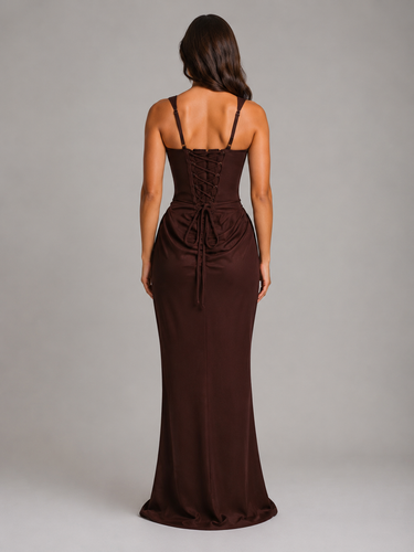 Close-up of the draped waist detail on a floor-length bodycon dress