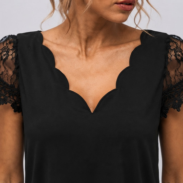 Side view showing the flared skirt and midi length of the dress