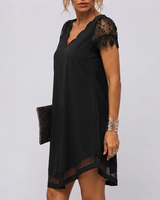 Close-up of the draped neckline detail on the midi dress