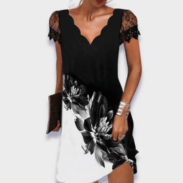 Model wearing the draped midi dress in an indoor setting
