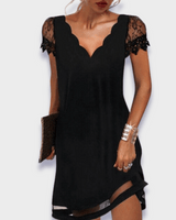 Front view of a sleeveless draped midi dress with fitted bodice