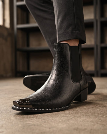 Detail shot of elasticated side panel on faux leather ankle boot