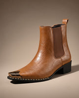 Side view of crinkled faux leather chelsea boot showing elasticated panel