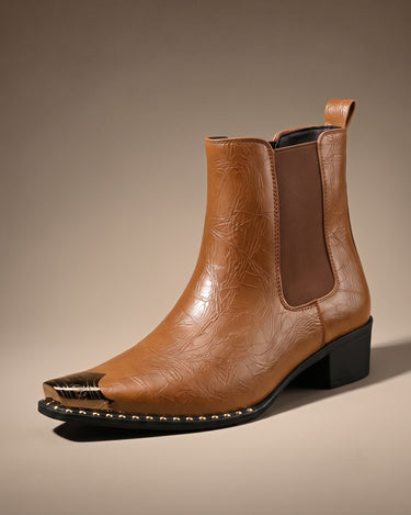Side view of crinkled faux leather chelsea boot showing elasticated panel