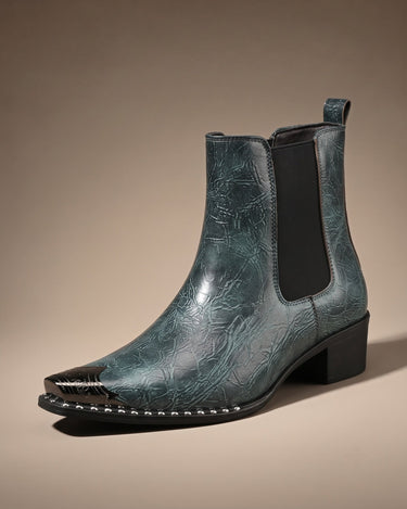 Close-up of squared metal toe cap and stud trim on faux leather boot