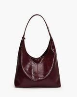 Glossy crinkled faux leather hobo shoulder bag with single strap, front view