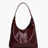 Glossy crinkled faux leather hobo shoulder bag with single strap, front view