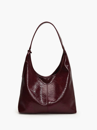 Glossy crinkled faux leather hobo shoulder bag with single strap, front view