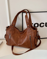 Flat lay of the bag open to show the internal compartment organisation