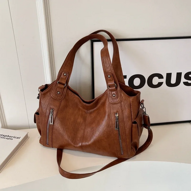 Flat lay of the bag open to show the internal compartment organisation