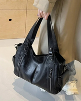 Front view of the faux leather shoulder bag showing the structured silhouette and dual straps