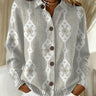 Front view of a fine knit polo jumper with button placket and ribbed hem