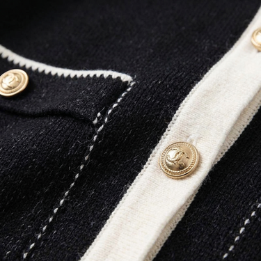 Side view of fitted hip-length fine knit cardigan silhouette