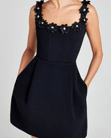 Side view of the fitted mini dress showing the tailored silhouette
