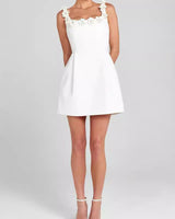 Model wearing the structured mini dress in an evening setting
