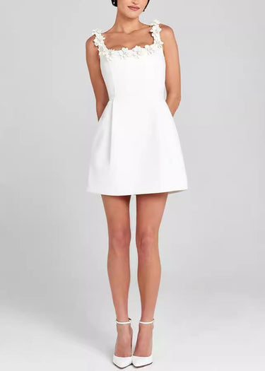 Model wearing the structured mini dress in an evening setting