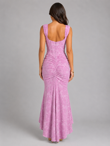 Side view showing the high-low fishtail hem and structured waist of the maxi dress