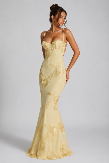Side view showing the flowing full-length skirt silhouette
