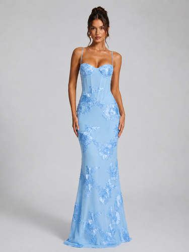 Three-quarter view of the fitted waist and maxi-length hem