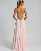 Side view showing the flowing full-length skirt and structured waist of the floral maxi dress