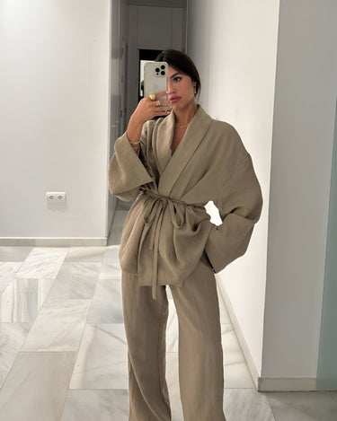 Side view showing the flowing silhouette of the khaki two-piece set