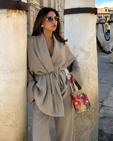 Close-up of the kimono top drape and open front detail in khaki