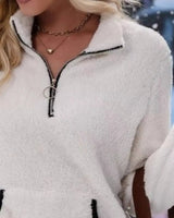 Three-quarter view of the fluffy half-zip pullover from the front