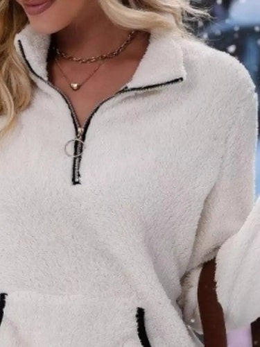 Three-quarter view of the fluffy half-zip pullover from the front