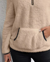 Model wearing the fluffy pullover styled with casual trousers