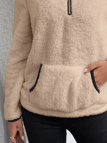 Model wearing the fluffy pullover styled with casual trousers