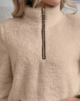Detail of the zip pull and collar on the half-zip fleece jumper