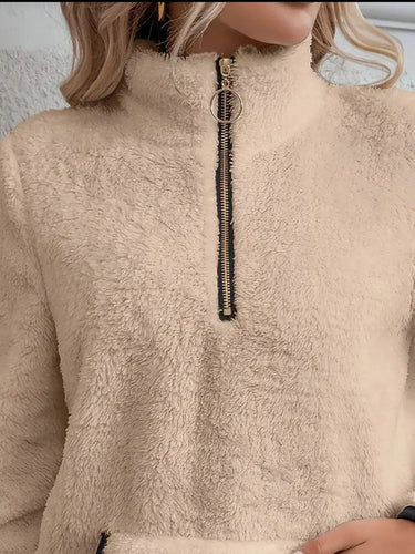 Detail of the zip pull and collar on the half-zip fleece jumper