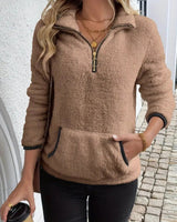 Front view of a fluffy teddy fleece half-zip pullover with kangaroo pocket