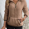 Front view of a fluffy teddy fleece half-zip pullover with kangaroo pocket