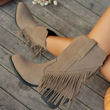 Lifestyle shot of the boots worn with straight-leg jeans