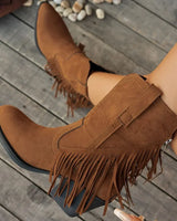Front view of suede cowboy boots with full-length fringe and pointed toe