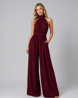 Full-length view of the jumpsuit showing the flowing wide-leg cut from waist to hem