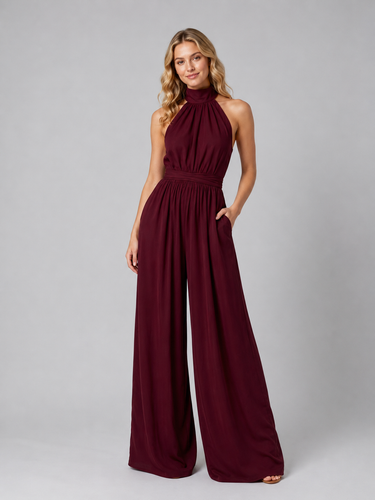Full-length view of the jumpsuit showing the flowing wide-leg cut from waist to hem