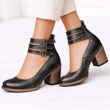 Close-up of block heel and side zip on women's ankle boots