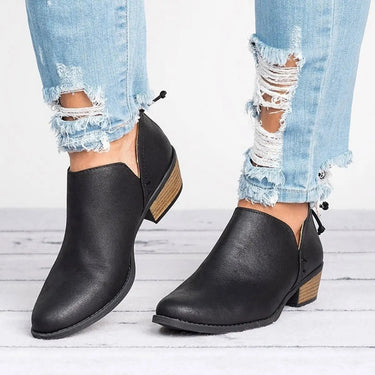 Front view of distressed faux leather ankle boot with V-cut opening