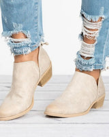 Rear view of block heel ankle boot showing heel height and boot silhouette