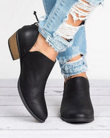 Close-up of elasticated gusset and V-cut opening on ankle boot