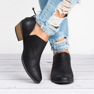 Close-up of elasticated gusset and V-cut opening on ankle boot