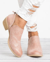 Slip-on heeled ankle boot with stacked block heel and rounded toe, side view