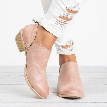 Slip-on heeled ankle boot with stacked block heel and rounded toe, side view