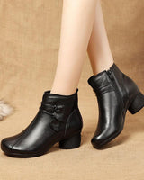 Close-up of decorative leaf motif on the outer side of the ankle boot