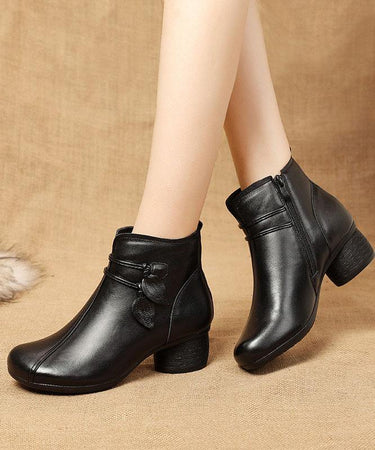 Close-up of decorative leaf motif on the outer side of the ankle boot