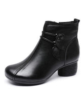 Side profile of block heel ankle boot showing leather-look upper